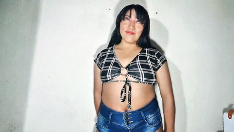 Shy Indian wife in checkered crop top and denim shorts