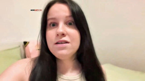 Surprised teen girl with wide eyes and open mouth in POV solo webcam closeup