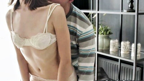 Slim Asian babe in white lace lingerie embraced by hot stud from behind