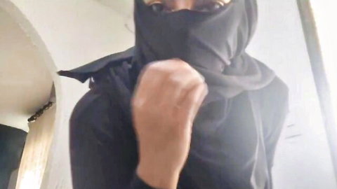 Arab MILF in hijab clenches fist in solo play thumbnail