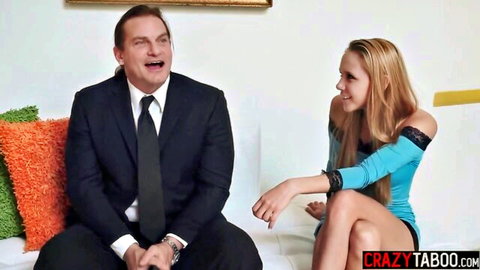 Nina Elle blonde MILF in sexy blue dress flirts with suited man on couch