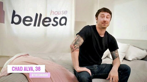 Chad Alva, 38, tattooed male model smirking in black tee from Bellesa House