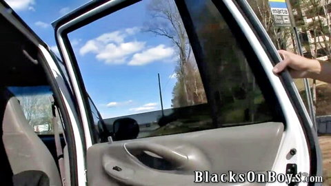 Ebony hand gripping open white van door in outdoor Blacks on Boys gay scene