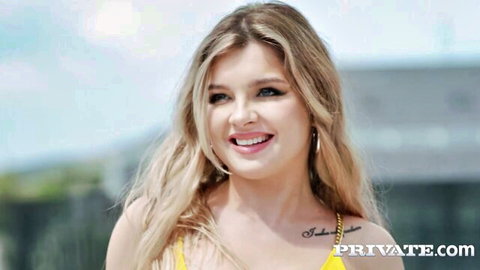 Renata Fox in yellow bikini, smiling seductively outdoors, teaser for intense DP action