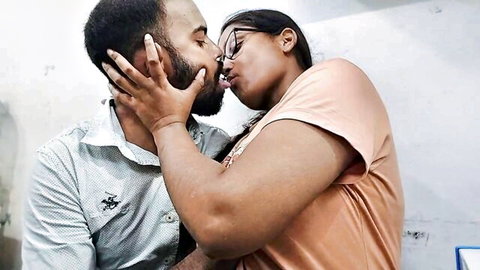 Black stepdad and stepdaughter passionately kissing in intimate embrace