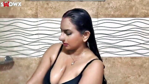 Curvy Indian babe in wet black top showing big cleavage in shower