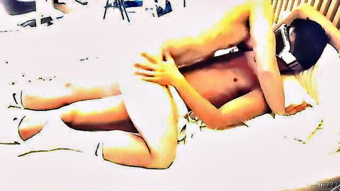 Blindfolded nude Korean woman in high heels spoons with naked Asian man groping her from behind in bed