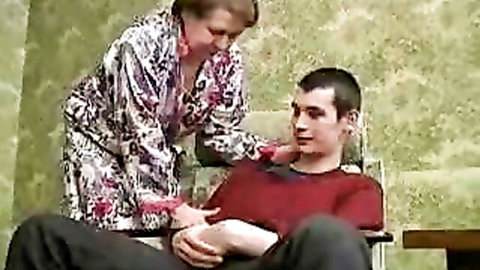 Russian granny in open robe seduces young man intimately