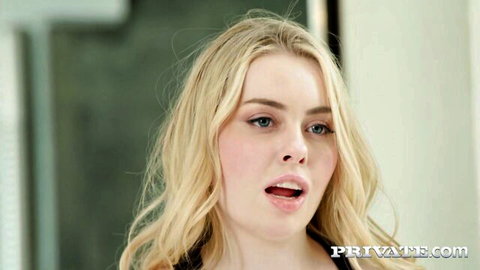 Blonde model in sensual expression, black top, from Private Yoga Retreat
