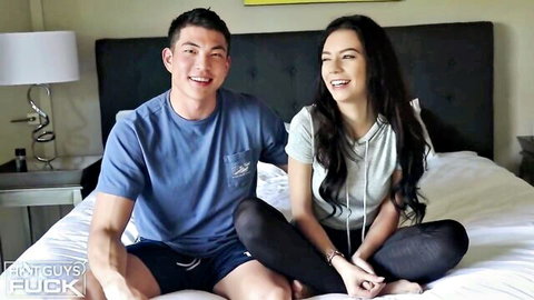 Rachel Ford and Sean Lee smiling on bed in casual outfits, teasing preview