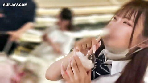 Tall Japanese schoolgirl in uniform holding cum-filled cup, JAV creampie scene