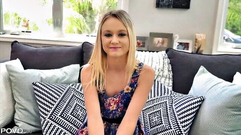 Blonde Kenzie Kai in floral dress, smiling seductively as lazy babysitter
