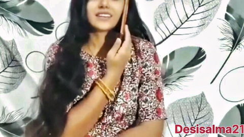 Desisalma21 Indian beauty smiling in floral top on phone call