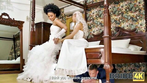 Two brides in wedding dresses tease man in bridal threesome adventure