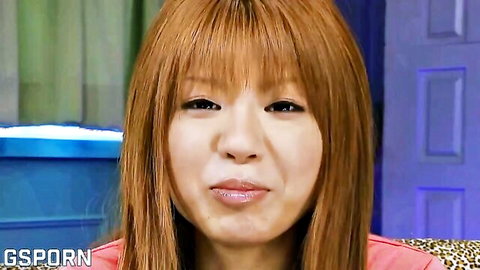Seductive Japanese woman with red bangs and pouty lips in JAV thumbnail