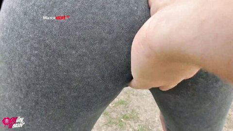 Miley Weasel in tight gray leggings, hand grabbing curvy ass in POV outdoor tease