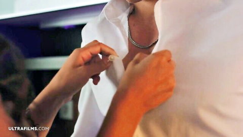 Elizabeth T teasing cleavage in open white shirt