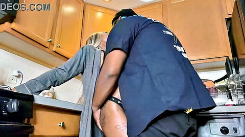 Ebony man gropes exposed shaved pussy of bent-over blonde housewife in kitchen