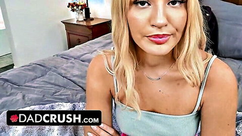 Blonde teen babe smiles seductively in tank top on bed for dadcrush taboo