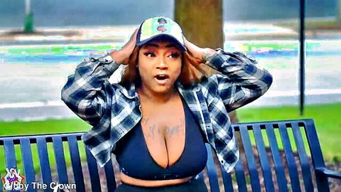 Shocked ebony babe with massive tits spilling from black bra on public park bench
