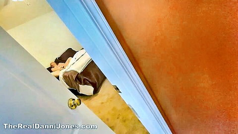 Voyeur spying on curvy blonde mature woman spooned by man in bed through cracked door
