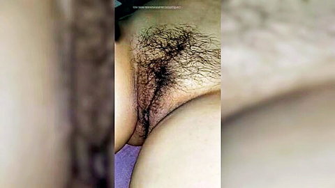 Closeup of hairy South Asian pussy with thick black bush and visible labia