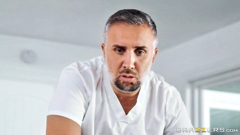 Keiran Lee in white shirt stares intensely in Gabbie Carter massage POV scene