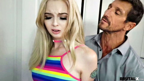 Lexi Lore in intense embrace with Tommy Gun, blonde in colorful top