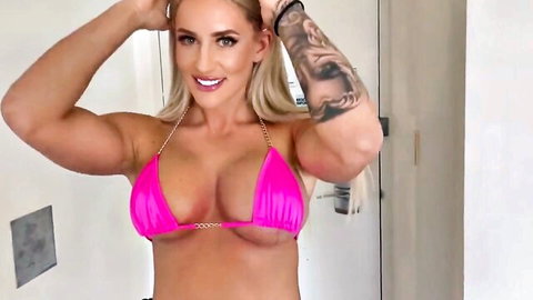 Barbie flexing in skimpy pink bikini, showing toned body and big tits