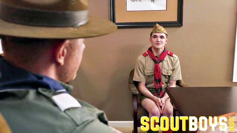 Legrand Wolf in uniform faces young scout Nathan James