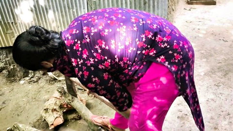 Desi bhabi in purple salwar kameez bending over outdoors in teasing pose