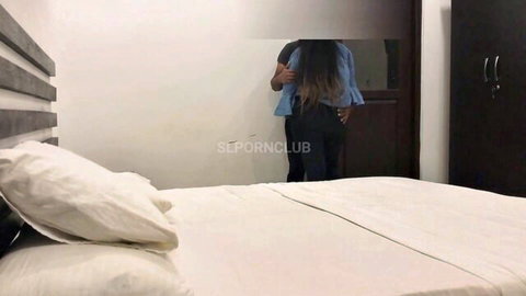 Sexy Indian woman with big juicy ass in tight black pants poses facing mirror in bedroom