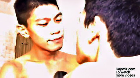 Two shirtless Chinese guys in intimate homemade gay mirror scene