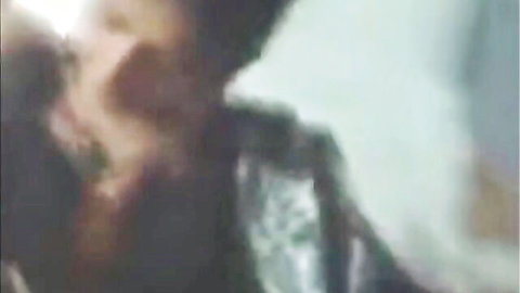 Blurry close-up of passionate kiss with Pakistani wife in white dress
