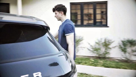 Curly-haired fit man in blue shirt by SUV, Laura Bentley dad roleplay scene
