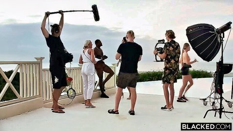 Blacked.com crew filming interracial porn BTS with hot blondes and black beauty on sunny balcony