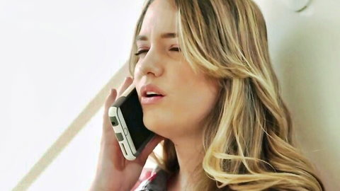 Blonde beauty in tight dress talks seductively on phone, hinting at wild lesbian ass feast