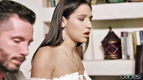 Abella Danger in off-shoulder white top seducing bearded man in erotic studio scene