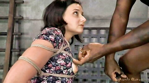 Bound short-haired brunette in floral dress groped during rough interracial bondage