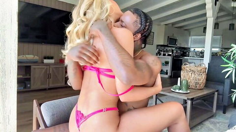 Savvy Suxx in pink lingerie during intense interracial embrace