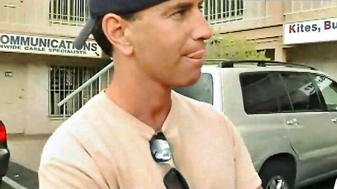 Man in casual attire outside motel, teasing for hot BBW MILF blowjob scene
