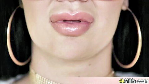 Jasmine Jae close-up with glossy pink lips, gold hoop earrings, and choker necklace