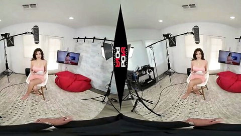Maya Woulfe in revealing pink dress posing seductively in VR setup