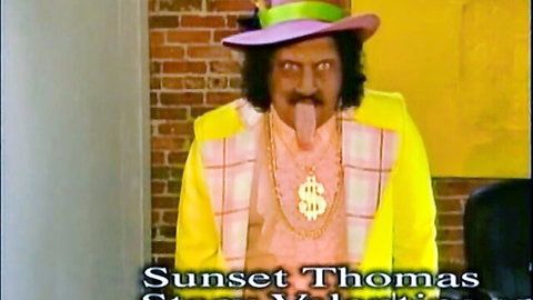 Sunset Thomas in yellow suit, green hat, gold chains, vintage hooker porn thumbnail