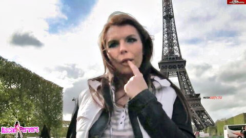 Aische Pervers teases with finger to lips in Paris, Eiffel Tower backdrop