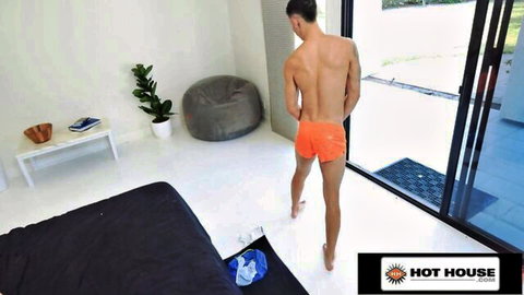 Aiden Ward exposes bare ass in pulled-down orange shorts, teasing gay hookup