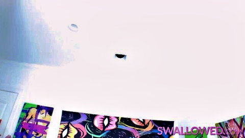 Swallowed studio room with vibrant graffiti art and pink posters