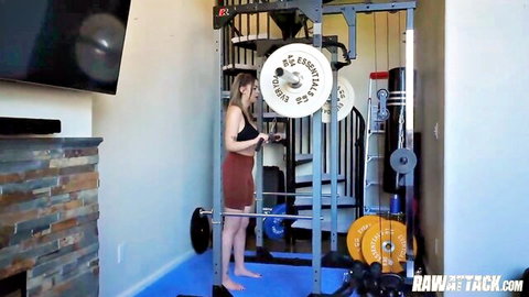 Bella Luna with round tits in short dress poses by weights in gym