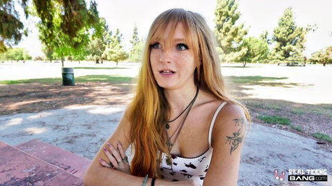 Ginger freckled babe Amber Stark in white tank top, outdoor park tease