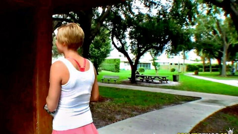 Tracy Lee blonde in white tank top and pink skirt teasing outdoors